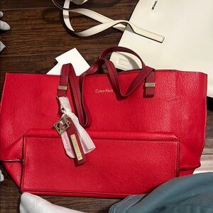 Calvin Klein Red Tote Bag with Structured Design and Tassel Accent